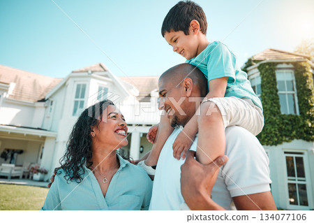 Mother, father and child happy outdoor as family in backyard of house with a smile, love and care. Man, woman and boy kid with parents for fun, playing and quality time together for happiness Mother, father and child happy outdoor as family in backyard of house with a smile, love and care. Man, woman and boy kid with parents for fun, playing and quality time together for happiness 134077106