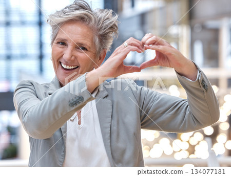 Business, heart and hands with portrait of woman in office for support, kindness and target. Corporate, goal and happy with senior female and positive gesture for success, achievement and motivation Business, heart and hands with portrait of woman in office for support, kindness and target. Corporate, goal and happy with senior female and positive gesture for success, achievement and motivation 134077181