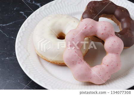Chocolate and strawberry donuts Chocolate and strawberry donuts 134077308