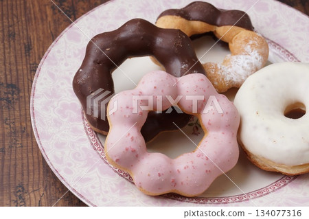 Chocolate and strawberry donuts Chocolate and strawberry donuts 134077316
