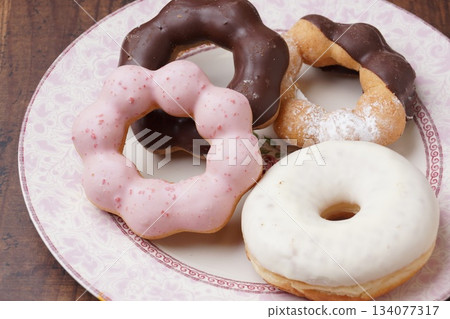 Chocolate and strawberry donuts Chocolate and strawberry donuts 134077317