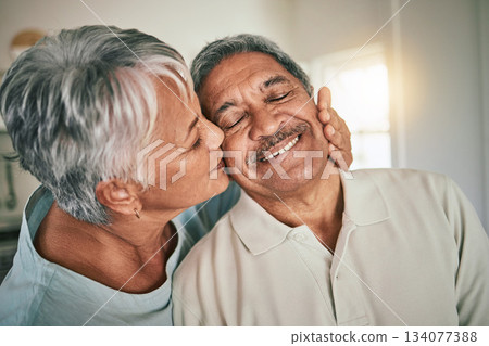 Love, kiss and elderly face of happy couple romance, spouse support and smile during retirement time together. Happiness, romantic marriage partner and senior woman, old man or people bonding at home 134077388