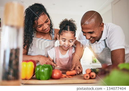 Family, cooking or cutting vegetables in kitchen or learning chef skill with happy parents or child together. Nutrition, healthy food or organic with people teaching and learn to cook in home bonding Family, cooking or cutting vegetables in kitchen or learning chef skill with happy parents or child together. Nutrition, healthy food or organic with people teaching and learn to cook in home bonding 134077404