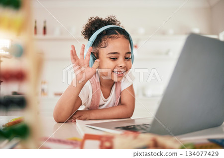 Laptop, video call communication and happy child elearning, wave hello or talking in remote youth development lesson. Home school education, learning in study and young kid listening on online class Laptop, video call communication and happy child elearning, wave hello or talking in remote youth development lesson. Home school education, learning in study and young kid listening on online class 134077429