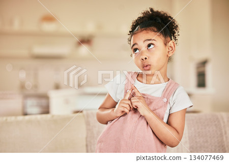 Thinking face, child and ideas in home on a living room couch and wondering with mockup. Young, lounge sofa and cute, curious girl in a relaxed house or indoor with youth idea and planning expression 134077469