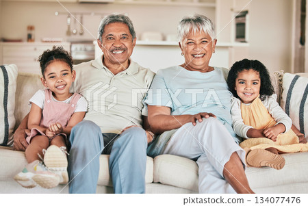Family in portrait, grandparents and children with smile, relax at home with love and bonding together on sofa. Happiness with people in lounge, relationship and spending quality time on the weekend Family in portrait, grandparents and children with smile, relax at home with love and bonding together on sofa. Happiness with people in lounge, relationship and spending quality time on the weekend 134077476