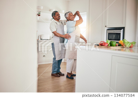 Happiness, cooking and senior couple dancing in the kitchen together feeling happy, excited and bonding in a home. Care, love and romantic old people or lovers dance enjoying retirement in a house Happiness, cooking and senior couple dancing in the kitchen together feeling happy, excited and bonding in a home. Care, love and romantic old people or lovers dance enjoying retirement in a house 134077584