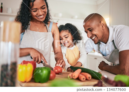 Family, cut and cooking vegetables together or learning chef skill with parents and child in kitchen. Nutrition, healthy food and organic with people teaching and learn to cook at home with bonding Family, cut and cooking vegetables together or learning chef skill with parents and child in kitchen. Nutrition, healthy food and organic with people teaching and learn to cook at home with bonding 134077600