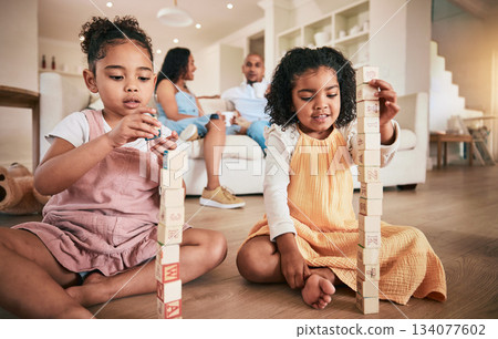 Toys, building blocks and children on a living room floor for bonding, learning and having fun with parents. Family, education and block activity by kids with creative cubes for development at home 134077602