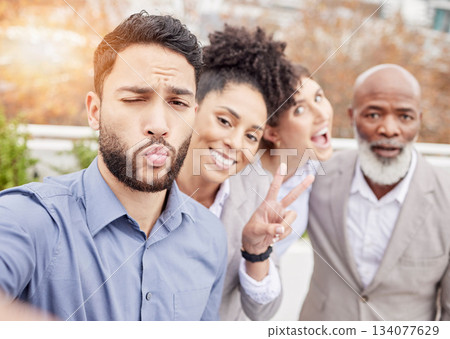 Business, team and crazy selfie outside with kiss, peace sign and happiness working together with diversity. Success, smile and employees taking outdoor group picture to celebrate achievement or goal Business, team and crazy selfie outside with kiss, peace sign and happiness working together with diversity. Success, smile and employees taking outdoor group picture to celebrate achievement or goal 134077629