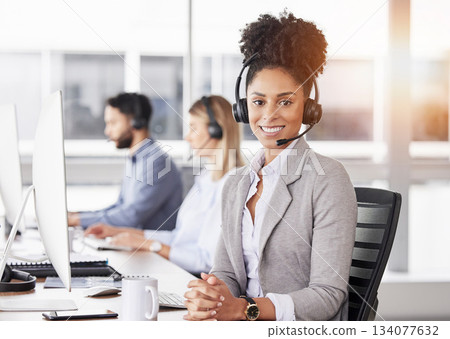 Happy, portrait and woman call center agent working on online consultation in the office. Crm, smile and African female customer service, telemarketing or sales consultant with headset in workplace. Happy, portrait and woman call center agent working on online consultation in the office. Crm, smile and African female customer service, telemarketing or sales consultant with headset in workplace. 134077632