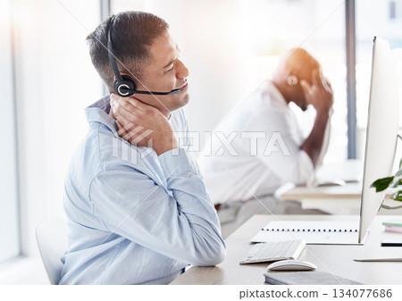 Neck, pain and stress of man in call center, joint inflammation and tired advisor in business office. Frustrated telemarketing agent, injury and muscle risk of burnout, problem or bad posture at desk 134077686