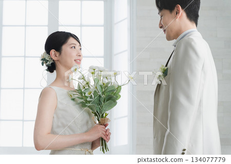 Bride in a dress and groom in a tuxedo Wedding image Bride in a dress and groom in a tuxedo Wedding image 134077779