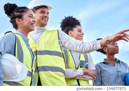 Architecture, construction and happy team in the city, pointing and looking together. Smile, teamwork and group of architects admiring their work in a town, laughing and talking about a site 134077873