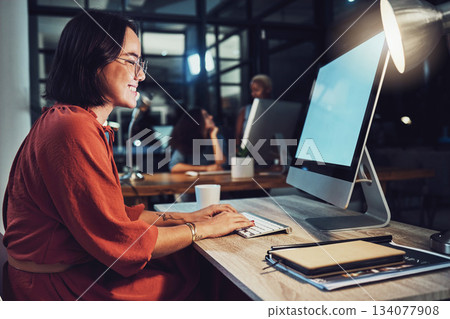 Night, business and woman typing, smile and focus on data analysis, email and project deadline. Female employee, creative and worker with a computer, screen and working late for digital planning Night, business and woman typing, smile and focus on data analysis, email and project deadline. Female employee, creative and worker with a computer, screen and working late for digital planning 134077908