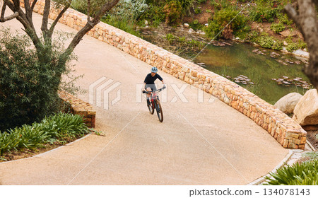 Top view, cycling and woman training, fitness and workout for wellness, competition and healthy lifestyle. Female cyclist, biker and athlete outdoor, biking and riding for adventure, journey or relax Top view, cycling and woman training, fitness and workout for wellness, competition and healthy lifestyle. Female cyclist, biker and athlete outdoor, biking and riding for adventure, journey or relax 134078143