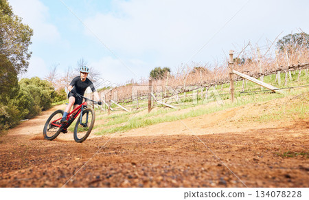 Riding, nature and a man on a bike for cycling, fitness or practice for a race in the countryside. Adventure, sports and a cyclist on a bicycle for training, sports and outdoor cardio exercise Riding, nature and a man on a bike for cycling, fitness or practice for a race in the countryside. Adventure, sports and a cyclist on a bicycle for training, sports and outdoor cardio exercise 134078228