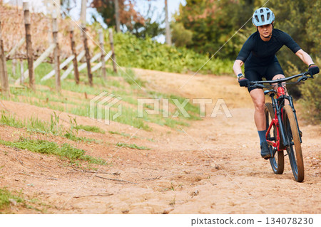 Bicycle, ride outdoor and woman on a bike with cycling for sports race on a road with mockup. Fitness, exercise and fast athlete doing sport training in nature on a park trail for cardio and workout Bicycle, ride outdoor and woman on a bike with cycling for sports race on a road with mockup. Fitness, exercise and fast athlete doing sport training in nature on a park trail for cardio and workout 134078230