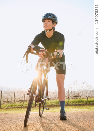 Rest, cycling and fitness with woman in nature for training, workout and sports cardio. Health, relax and thinking with female cyclist riding on bike in outdoor for exercise, endurance and challenge Rest, cycling and fitness with woman in nature for training, workout and sports cardio. Health, relax and thinking with female cyclist riding on bike in outdoor for exercise, endurance and challenge 134078251