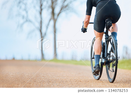 Bicycle, outdoor and person on a bike ride with mockup for sports race on a gravel road. Fitness, exercise and fast athlete doing sport training in nature on a park trail for cardio and workout Bicycle, outdoor and person on a bike ride with mockup for sports race on a gravel road. Fitness, exercise and fast athlete doing sport training in nature on a park trail for cardio and workout 134078253