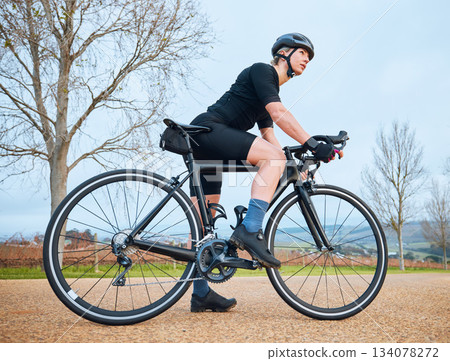 Ready, cycling and fitness with woman in nature for training, workout and sports cardio. Health, relax and thinking with female cyclist riding on bike in outdoor for exercise, endurance and challenge 134078272