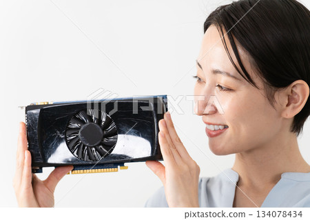 Woman holding a graphics card Technology image 134078434