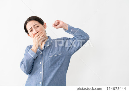 Woman wearing pajamas Lifestyle image Woman wearing pajamas Lifestyle image 134078444