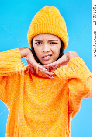 Portrait of woman in winter fashion with confused face, beanie and doubt isolated on blue background. Style, expression and attitude, gen z girl on studio backdrop with warm clothing for cold weather Portrait of woman in winter fashion with confused face, beanie and doubt isolated on blue background. Style, expression and attitude, gen z girl on studio backdrop with warm clothing for cold weather 134078502