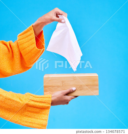 Tissue, box and hands of woman on blue background for sinus, sickness and flu on blue background. Healthcare mockup, paper and girl with wipe, napkin and handkerchief for hygiene, allergy and sneeze 134078571