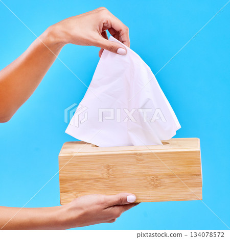 Tissue, blue background and hands with box for handkerchief for flu, sickness and sinus mockup. Healthcare, toiletries and woman with hygiene wipe, napkin and paper for cleaning, allergy and sneeze 134078572