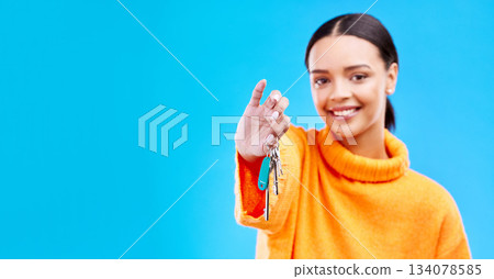 Portrait, mockup and woman with a key, smile and new homeowner against a blue studio background. Face, female person and happy girl with keys, happiness and property owner with success or real estate 134078585