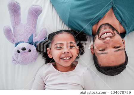Portrait of dad, child and teddy bear on bed from above, bonding and love with play time to relax. Smile, happiness and man with kid together in bedroom of family home in morning or bedtime in Mexico 134078739