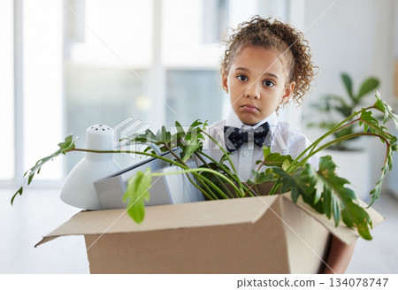 Sad, portrait and a child playing as a business person with a box of belongings after fired. Unhappy, jobless and a little girl pretending to leave an office and packing after work retrenchment Sad, portrait and a child playing as a business person with a box of belongings after fired. Unhappy, jobless and a little girl pretending to leave an office and packing after work retrenchment 134078747