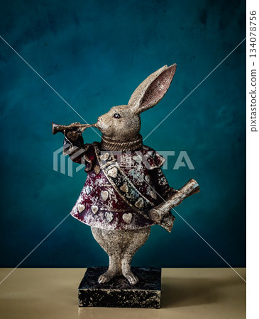 Retro rabbit figurine playing a trumpet 134078756