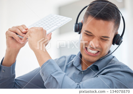 Stress, frustrated or angry man in call center breaking computer keyboard in crm consulting fail or 404 glitch. Anger problem, crazy screaming or mad customer services agent in technology smash 134078870