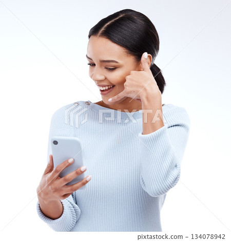 Phone call, sign and woman isolated on a white background for networking, contact and communication on mobile app. Happy young person talking, hello or conversation on cellphone service in studio 134078942
