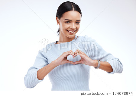 Portrait, heart and hand gesture with a woman on a white background isolated in studio for health or love. Face, hands and emoji with an attractive young female indoor for romance or valentines day Portrait, heart and hand gesture with a woman on a white background isolated in studio for health or love. Face, hands and emoji with an attractive young female indoor for romance or valentines day 134078974