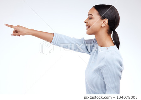 Studio, profile and happy model pointing at sales promotion, advertising copy space and discount deal mockup. Brand commercial, marketing and product placement gesture for woman on white background 134079003