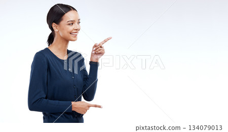 Happy studio woman, mockup and pointing at sales promotion, advertising copy space or discount deal mock up. Commercial brand offer, presentation or female marketing gesture on white background Happy studio woman, mockup and pointing at sales promotion, advertising copy space or discount deal mock up. Commercial brand offer, presentation or female marketing gesture on white background 134079013