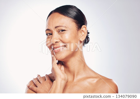 Beauty, mature and portrait of woman in studio for skincare, facial and spa treatment. Smile, cosmetics and mature with female model on white background for anti aging, natural glow and self care 134079090
