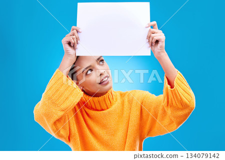 Poster, thinking and face of woman on blue background for announcement, news and information. Advertising, mockup studio and isolated happy girl with paper sign for brand, logo and marketing Poster, thinking and face of woman on blue background for announcement, news and information. Advertising, mockup studio and isolated happy girl with paper sign for brand, logo and marketing 134079142