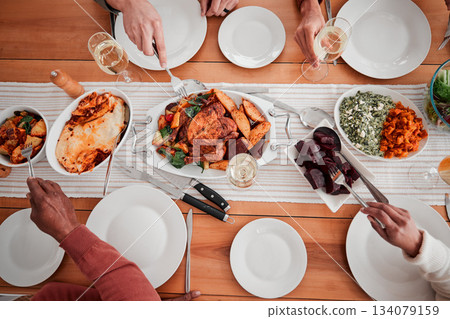 Food, dinner and party with table setting top view, celebration and holiday with Christmas or thanksgiving. Social event, hungry people and wine, chicken and veg with gourmet meal, festive and feast 134079159