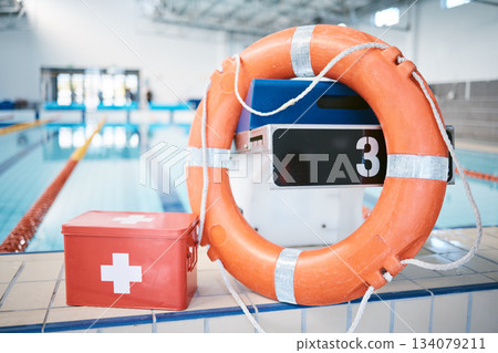Swimming, equipment and first aid at a pool for security, safety and emergency. Healthcare, guarding and kit for protection, help and support for water activities, sports competition or recreation 134079211