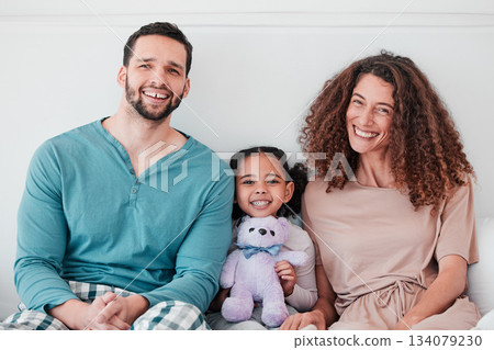 Family, portrait and parents are happy with child, relax with smile and diversity, love and care. Spending quality time together, bonding and relationship, man and woman with young girl at home Family, portrait and parents are happy with child, relax with smile and diversity, love and care. Spending quality time together, bonding and relationship, man and woman with young girl at home 134079230