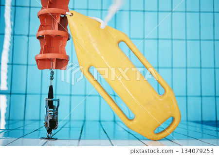 Above, water and a buoy in a pool for a lifeguard, life saving and safety. Board, summer and equipment for protection, security and danger while swimming, rescuing and protecting from drowning 134079253
