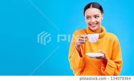 Tea, woman and smile in studio with mockup and happiness with mug. Isolated, blue background and happy female model and young person relax with casual winter fashion and joy from hot drink smiling Tea, woman and smile in studio with mockup and happiness with mug. Isolated, blue background and happy female model and young person relax with casual winter fashion and joy from hot drink smiling 134079364