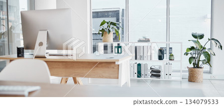 Empty office, interior and computer on desk in workplace, company or workspace. Room, desktop and table with corporate furniture, plants and window with modern design for business with nobody. Empty office, interior and computer on desk in workplace, company or workspace. Room, desktop and table with corporate furniture, plants and window with modern design for business with nobody. 134079533