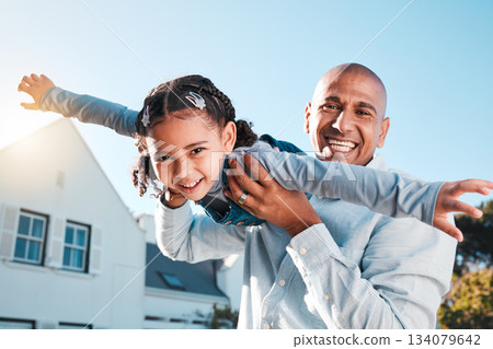 Family, portrait and father lifting girl in air for garden bonding, quality time and playing outdoors together. Flying, happiness and dad carry child on summer vacation, weekend and holiday at home Family, portrait and father lifting girl in air for garden bonding, quality time and playing outdoors together. Flying, happiness and dad carry child on summer vacation, weekend and holiday at home 134079642