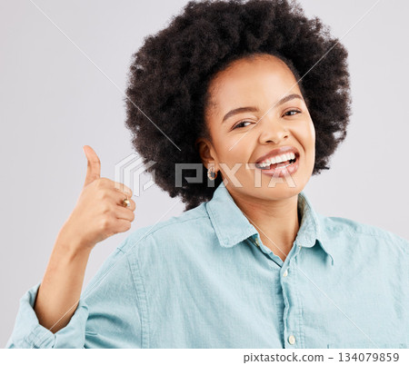 Portrait, thumbs up and black woman laughing in studio isolated on a white background. Success, happiness and person with hand gesture or emoji for winning, approval or agreement, like or thank you. Portrait, thumbs up and black woman laughing in studio isolated on a white background. Success, happiness and person with hand gesture or emoji for winning, approval or agreement, like or thank you. 134079859