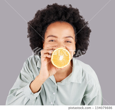Portrait, orange and black woman with fruit in studio isolated on a white background. Food, top view and happiness of person or female with vitamin c, nutrition or healthy diet, citrus or vegan detox 134079886